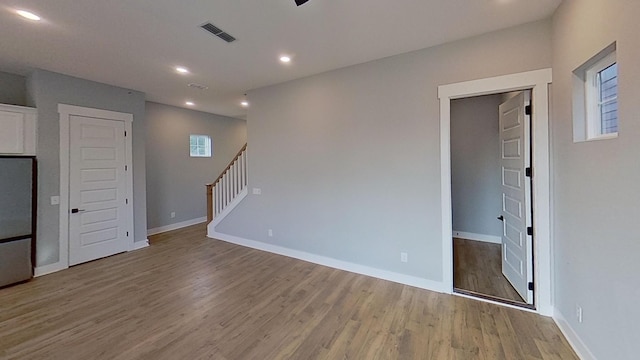 661 Gustaf Dr, Whites Creek, TN 37189 - spare room featuring wood finished floors, recessed lighting, stairway, and baseboards
