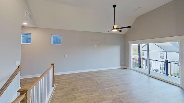 empty room with light wood-style flooring, visible vents, baseboards, and ceiling fan