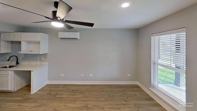 661 Gustaf Dr, Whites Creek, TN 37189 - kitchen featuring a wall unit AC, a sink, ceiling fan, plenty of natural light, and recessed lighting