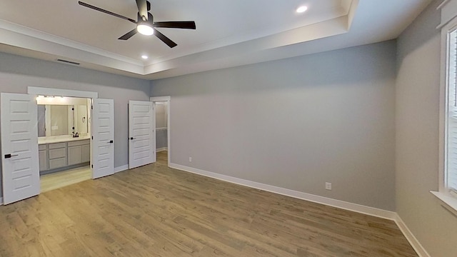 661 Gustaf Dr, Whites Creek, TN 37189 - unfurnished bedroom with a raised ceiling, light wood finished floors, baseboards, recessed lighting, and ornamental molding