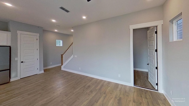 661 Gustaf Dr, Whites Creek, TN 37189 - spare room featuring wood finished floors, recessed lighting, stairs, and baseboards