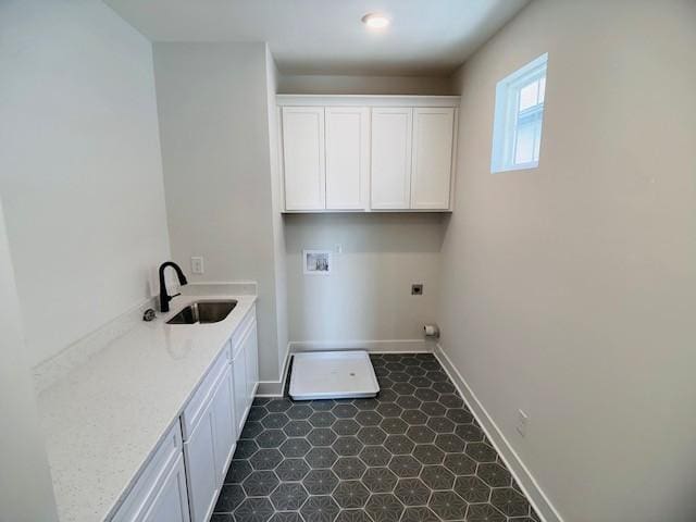 clothes washing area with hookup for a washing machine, cabinet space, baseboards, and electric dryer hookup