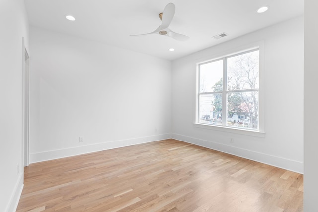 unfurnished room with ceiling fan and light hardwood / wood-style floors