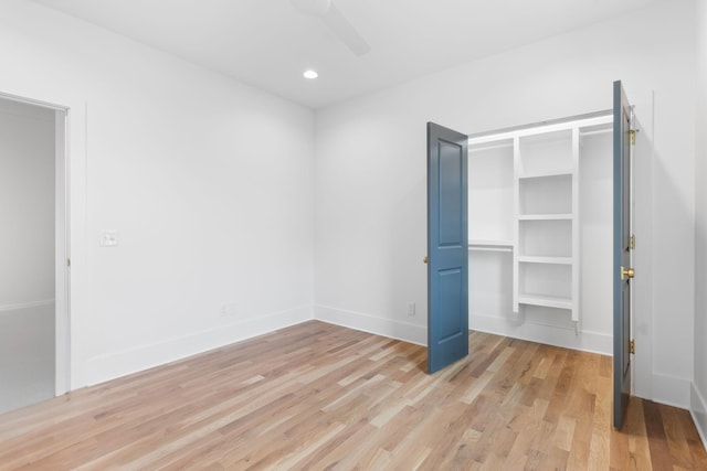 unfurnished bedroom featuring ceiling fan and light wood-type flooring