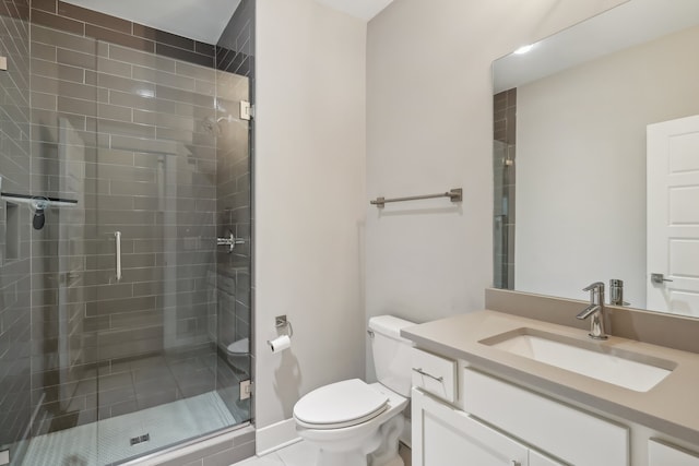 bathroom featuring vanity, toilet, tile patterned floors, and a shower with door