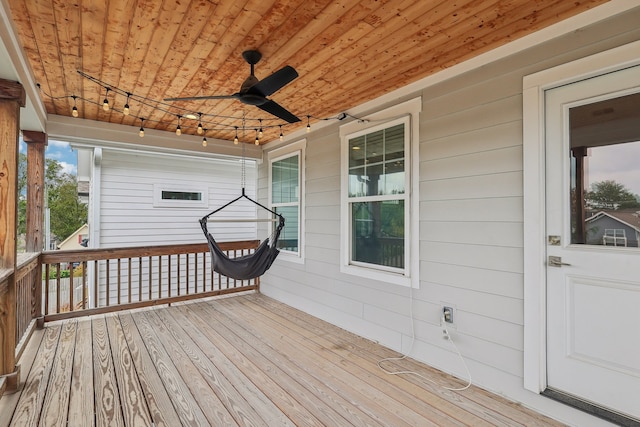 wooden deck with ceiling fan