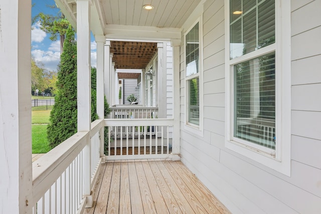 wooden terrace with a porch