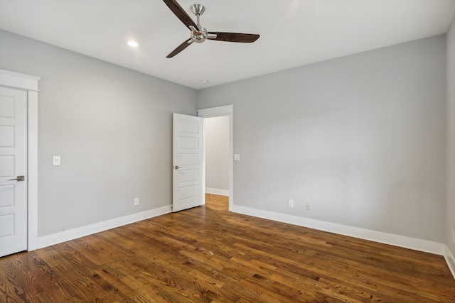 unfurnished room with ceiling fan and dark hardwood / wood-style floors