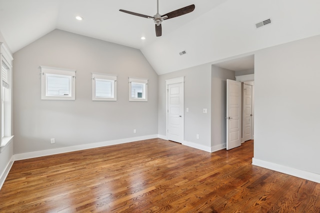 unfurnished room featuring ceiling fan, hardwood / wood-style flooring, and vaulted ceiling