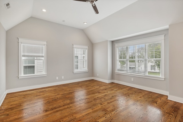 unfurnished room with wood-type flooring, vaulted ceiling, and ceiling fan