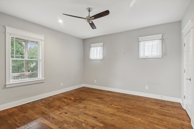 unfurnished room with ceiling fan and hardwood / wood-style flooring