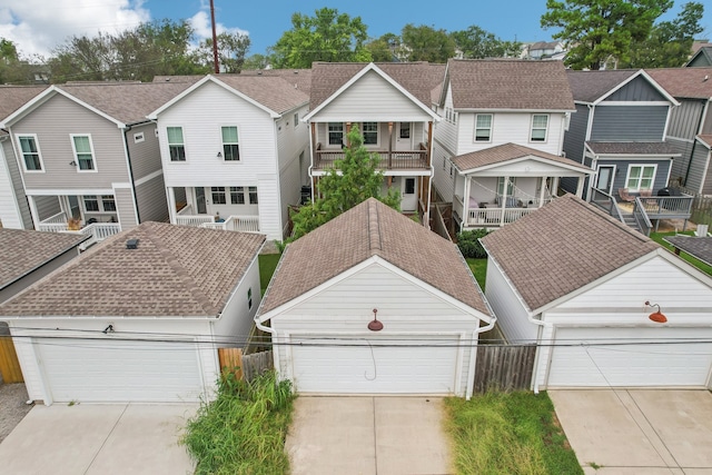 view of front of home featuring a balcony and a garage