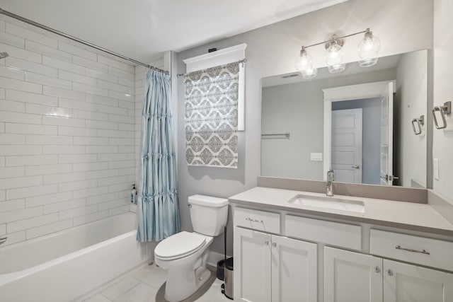 full bathroom with vanity, toilet, shower / bath combo with shower curtain, and tile patterned floors