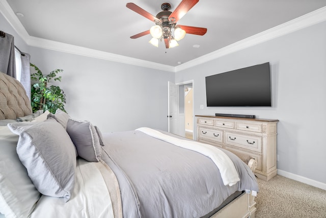 carpeted bedroom featuring ceiling fan and crown molding