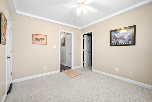 unfurnished bedroom with ceiling fan and carpet flooring