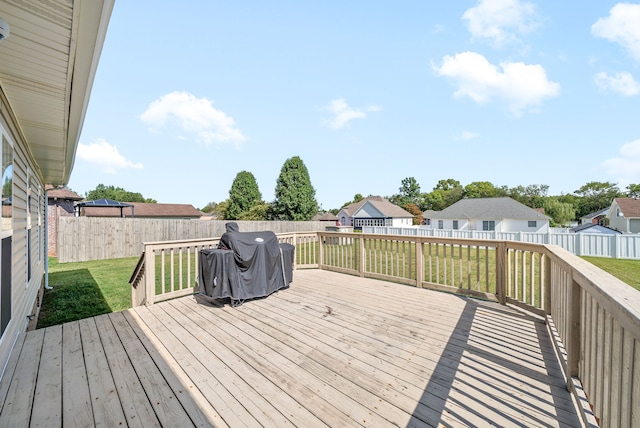 wooden terrace with a yard