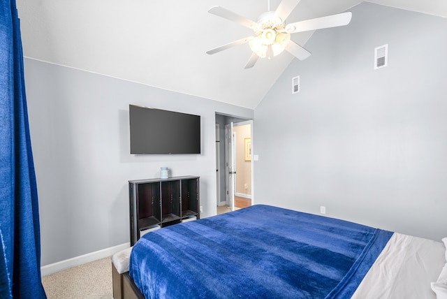 bedroom featuring ceiling fan, carpet flooring, and vaulted ceiling