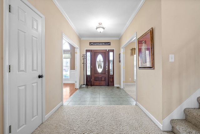 entrance foyer featuring light tile patterned flooring and crown molding