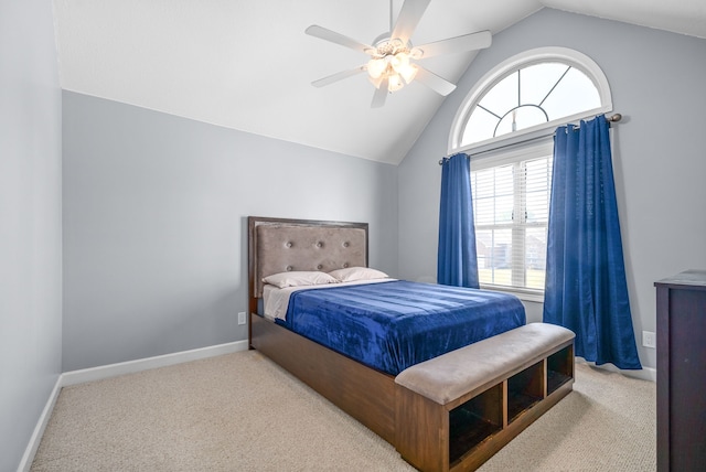 carpeted bedroom with ceiling fan and lofted ceiling