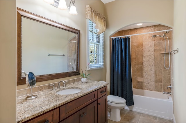 full bathroom with shower / tub combo, tile patterned floors, vanity, and toilet