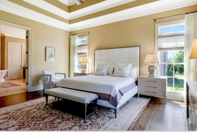 bedroom featuring crown molding, ceiling fan, and dark wood-type flooring