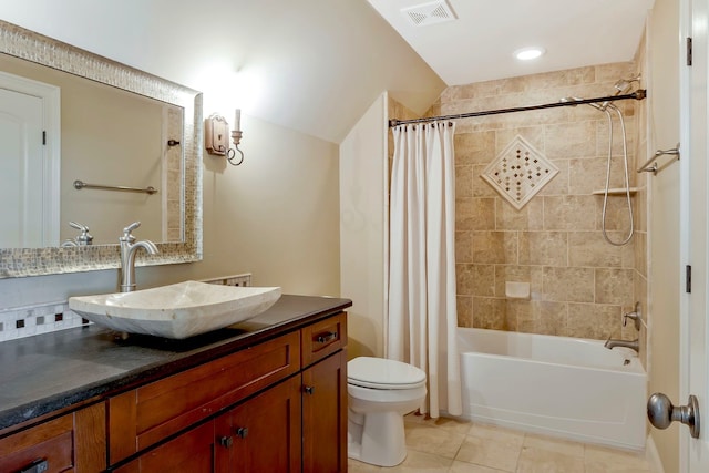 full bathroom with shower / tub combo, tile patterned flooring, vanity, and toilet