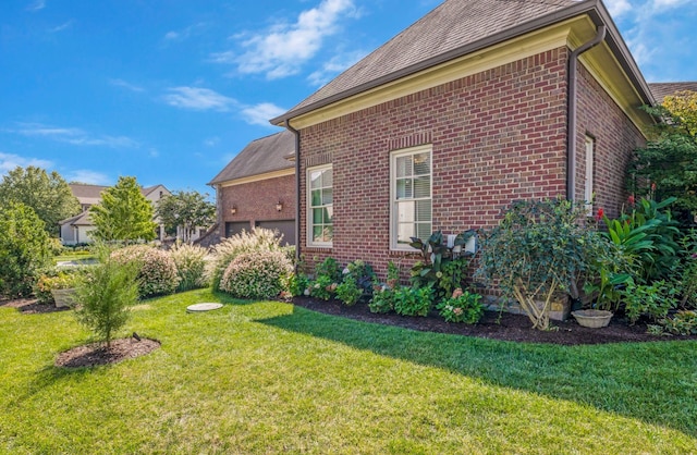 view of property exterior featuring a lawn