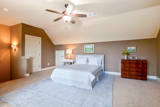 carpeted bedroom with vaulted ceiling and ceiling fan