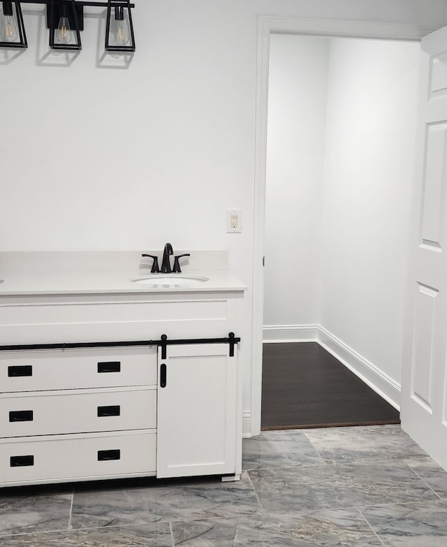 bathroom with hardwood / wood-style floors and vanity