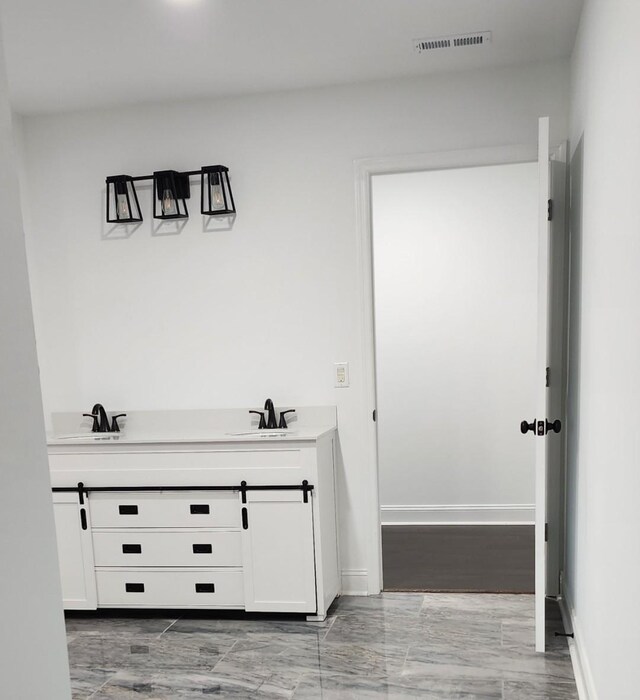 bathroom featuring hardwood / wood-style floors and sink