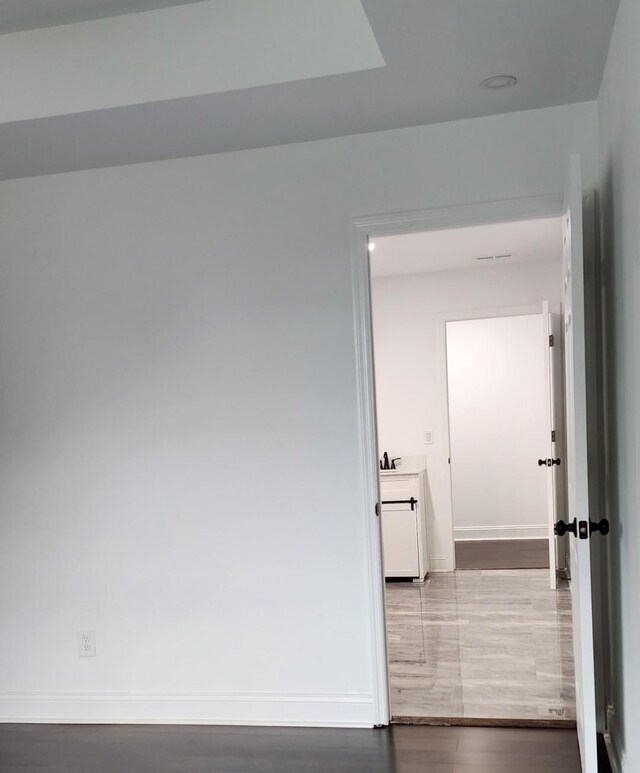 corridor featuring hardwood / wood-style flooring