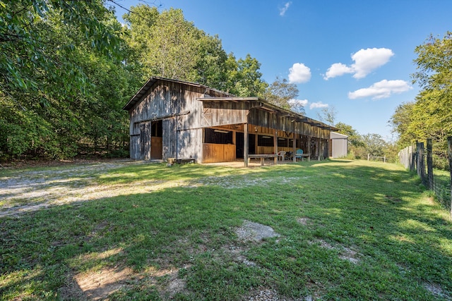 rear view of house with an outbuilding