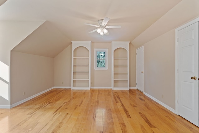 additional living space with ceiling fan, vaulted ceiling, and hardwood / wood-style floors