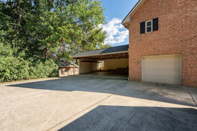 exterior space featuring a carport and a garage