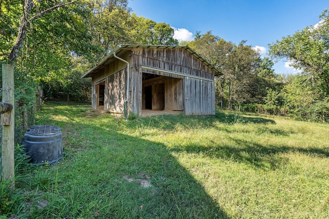 exterior space with central AC and an outbuilding