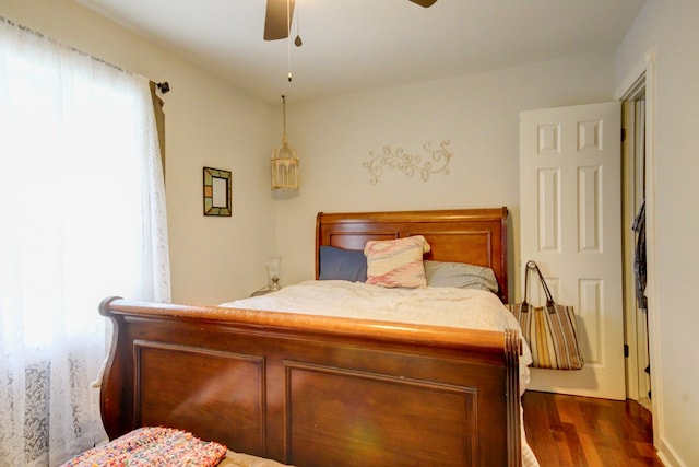 bedroom featuring ceiling fan and dark hardwood / wood-style floors