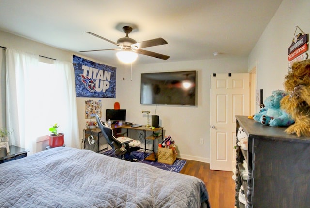 bedroom featuring ceiling fan and dark wood-type flooring