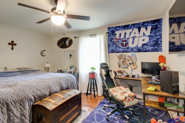 bedroom with hardwood / wood-style floors and ceiling fan