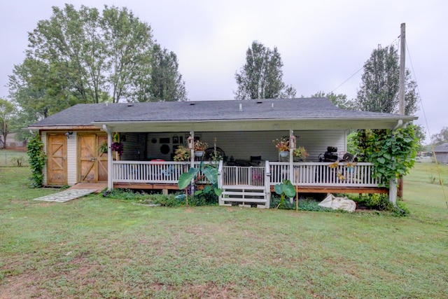 back of house with a lawn