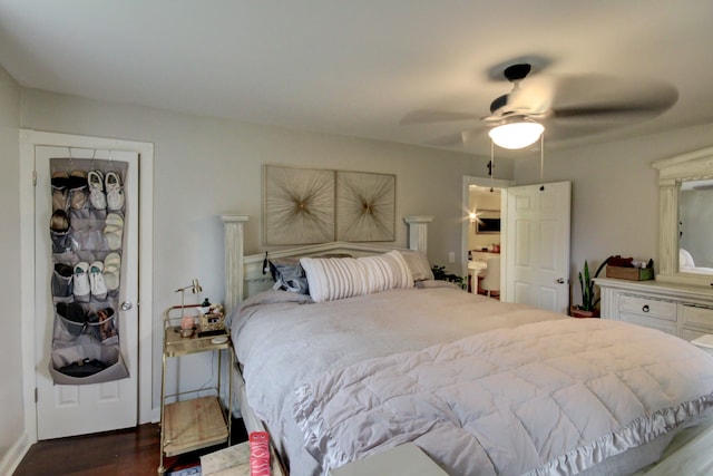 bedroom with dark hardwood / wood-style flooring and ceiling fan