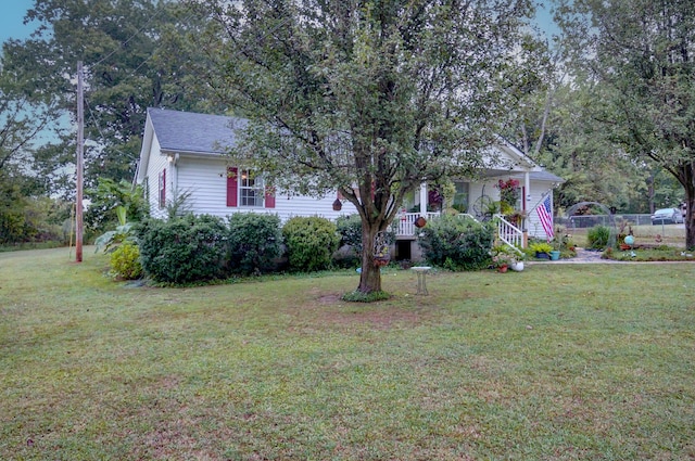 view of front of house with a front lawn and covered porch