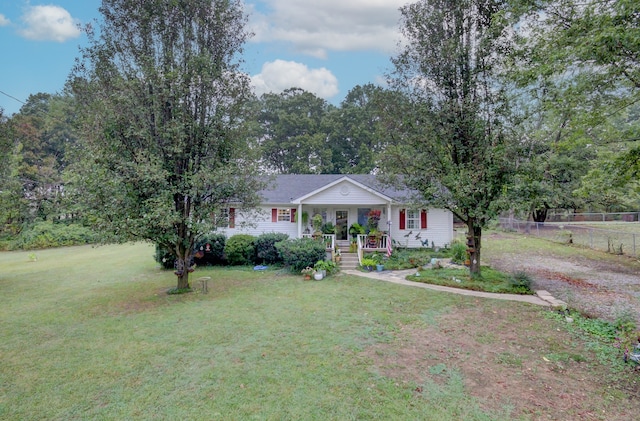 single story home featuring covered porch and a front lawn