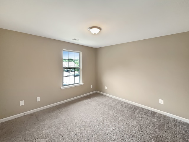 unfurnished room featuring carpet flooring