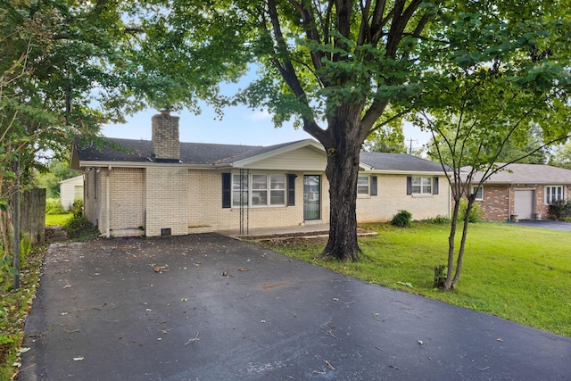 314 Robin Rd, Bowling Green, KY 42101 - ranch-style home featuring a chimney, aphalt driveway, a front yard, and brick siding