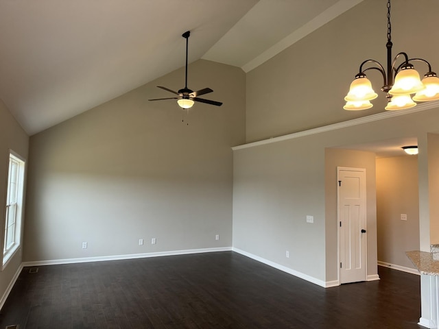 104 Thacker Dr, Portland, TN 37148 - spare room featuring baseboards, dark wood-style flooring, high vaulted ceiling, and ceiling fan with notable chandelier