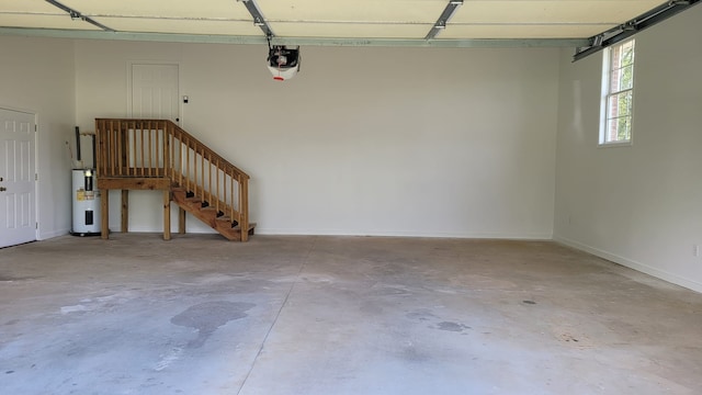 garage featuring a garage door opener and water heater