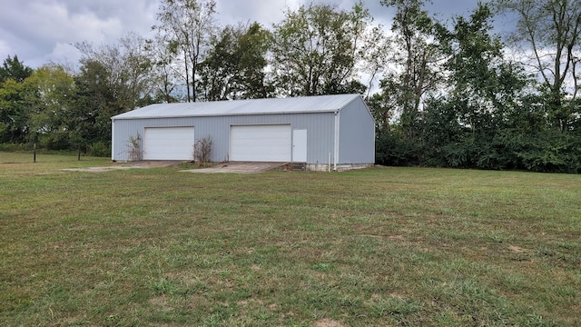 garage featuring a yard