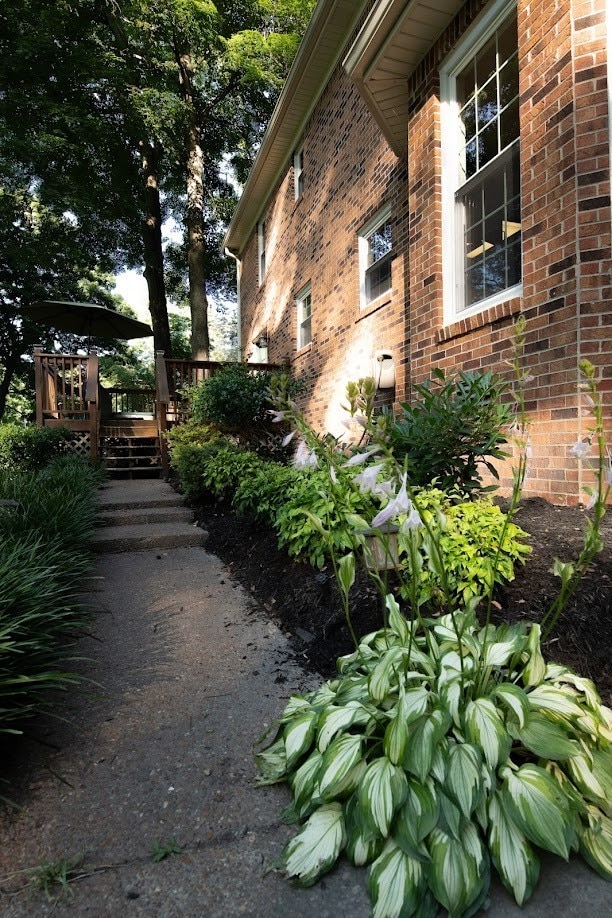 view of side of home featuring a deck