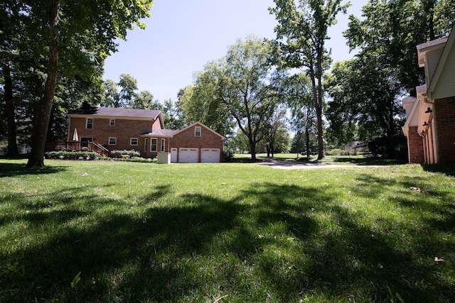 view of yard featuring a garage