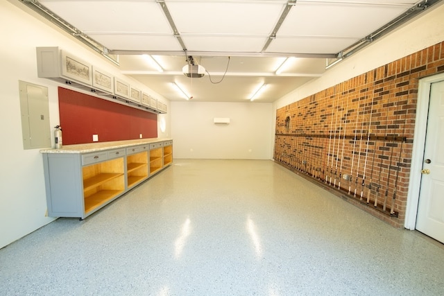 garage featuring a garage door opener and electric panel